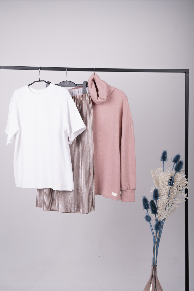 Basic women's clothes. Woman minimalist wardrobe in pastel color. Spring fashion trending concept